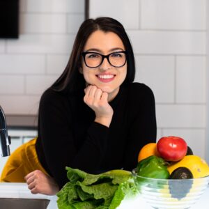 Woman Smiling in the kitchen - Best Ways To Lose Weight - RumboMag - Maintaining a healthy weight is important for overall health and well- being