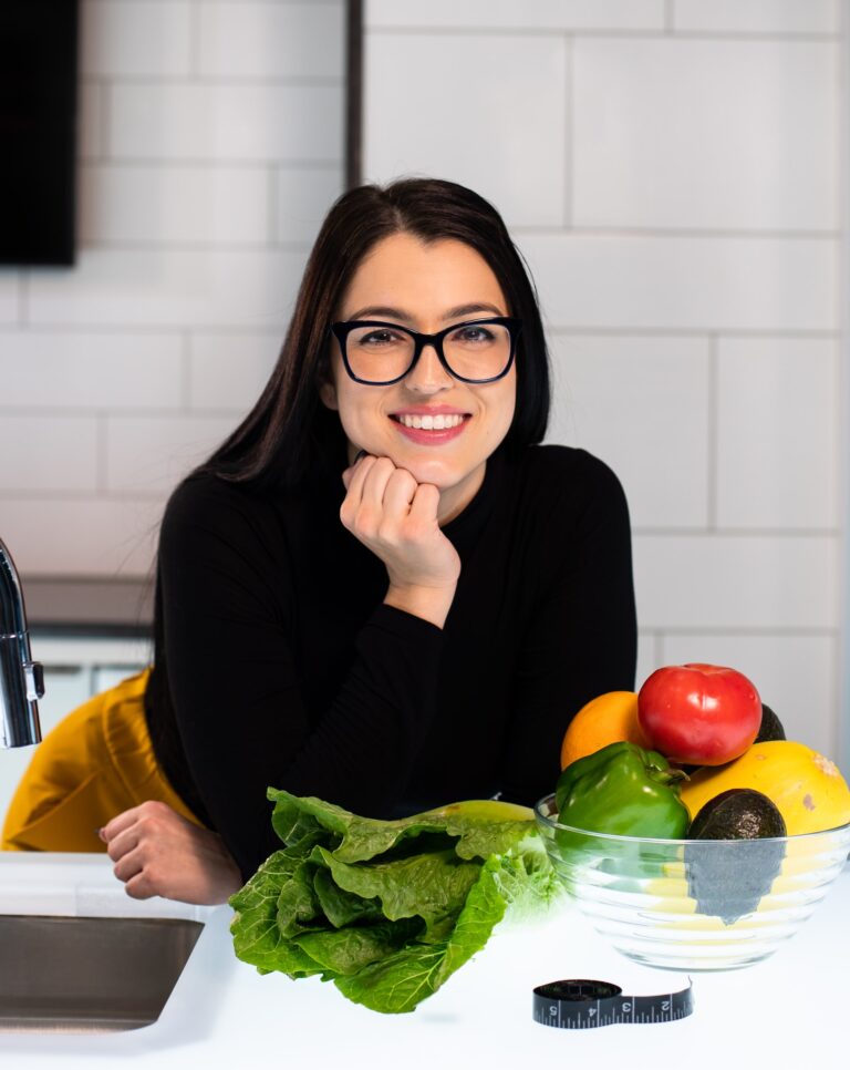 Woman Smiling in the kitchen - Best Ways To Lose Weight - RumboMag - Maintaining a healthy weight is important for overall health and well- being