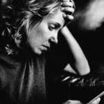 white-woman-using-mobile-phone - RumboMag - Tips for Overcoming Anxiety